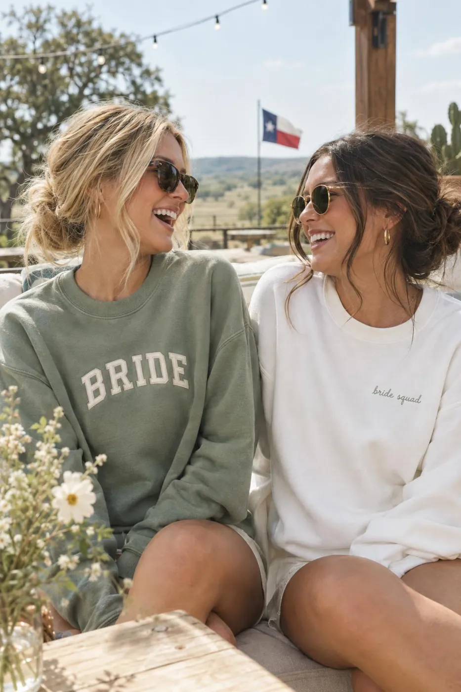 Two friends in matching Bride sweatshirts