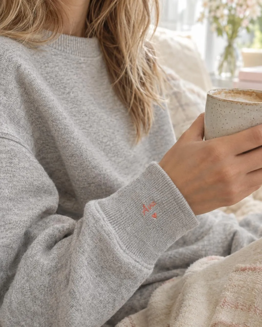 Sweatshirt sleeve embroidered with a small name
